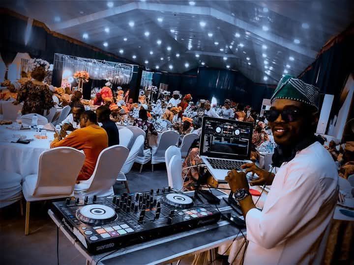 Deejay Bassman performing for guests in traditional attire